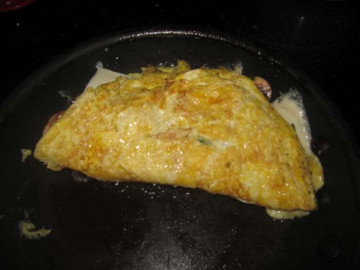 Sometimes folding the omelet can be tricky. What I do is load the filling on one side of the omelet. That way, you can easily get your spatula under the empty side to fold it over.