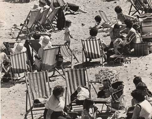 Redcar Beach 'under siege', deckchairs as far as the eye can see, Candy Floss vendors, tea stalls, ice cream sellers, donkey rides along the tide line, Punch & Judy shows (at least two) and people tramping up and down looking for family or friends