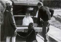 Ginny jumps in the trunk to practice Zoe's scene. Zoe was supposed to scratch at the trunk of the car.