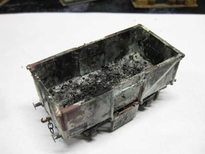 Another one of my own wagons. This is the Dapol 'Airfix' BR 16t mineral with one door down. Unswept coal 'residue' left in wagon bottom. Kit modified to take Smiths (W&H) 3 link coupling hook shaft and weighted on underside. Heavily weathered