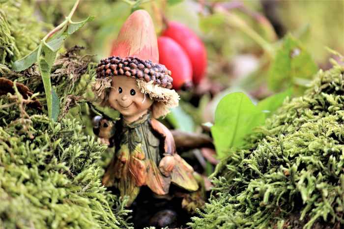 A fairy or maybe it's an elf, anyway this little character looks quite happy with its mossy garden.
