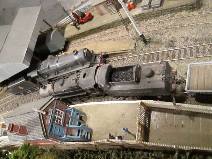 Ex-LMS classes cross at Thoraldby. 'Black 5' 4-6-0 runs up light engine with 4MT 2-6-0 'Flying Pig' returning empty freight stock