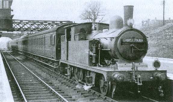 In the Eastern Region (ex-GER) a Gidea Park stopping train is seen underway under headcode