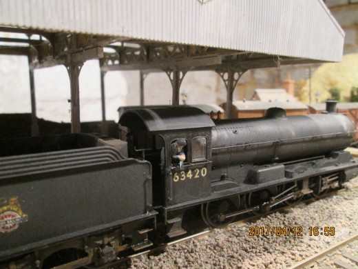 Hornby Q6 0-8-0 wouldn't be complete without crew. The driver whiles his time away at the starter signal - ModelU, see also below