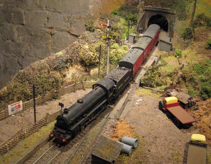 61339 again, this time with a pair of ex-LNER horse boxes in BR livery - viewed the opposite direction - with a pigeon/parcels van bringing up the rear at the tunnel mouth