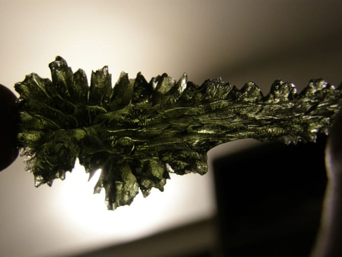 One of the many beautiful formations possible with moldavite.