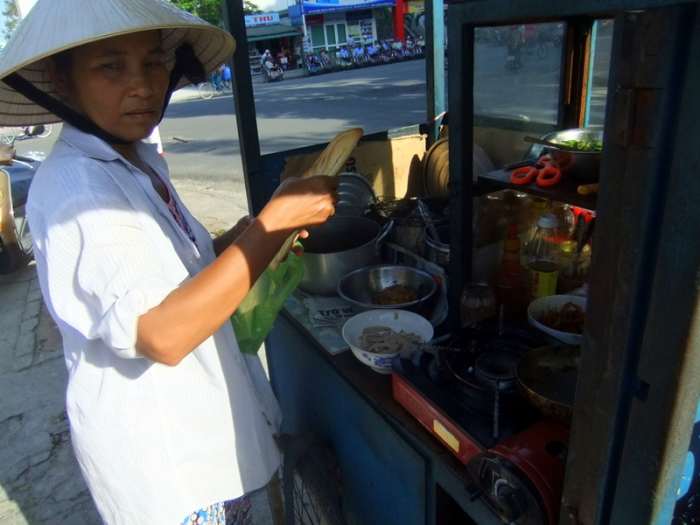 Street Photo in Hue, Vietnam: This food vendor was selling Vietnamese food for breakfast near our hotel in Hue