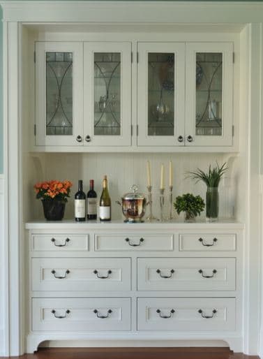 built in cabinets with furniture quality knobs and pulls set this bank of cabinets ready for your butler or for you personal use.
