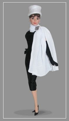 Audrey Hepburn Barbie Doll in classy black and white with white hat and white mink jacket and classic little black dress