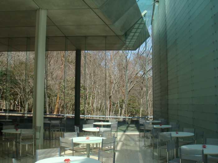 Cafe at Pola Museum. Can you appreciate the huge optic fiber covered wall, the glass wall to the forest and the natural light that seeps through.