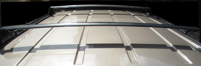 Both end rails should be used to make sure the drill holes are correct. Set the base rails and the end rails across the roof to determine where the screw holes should be drilled.