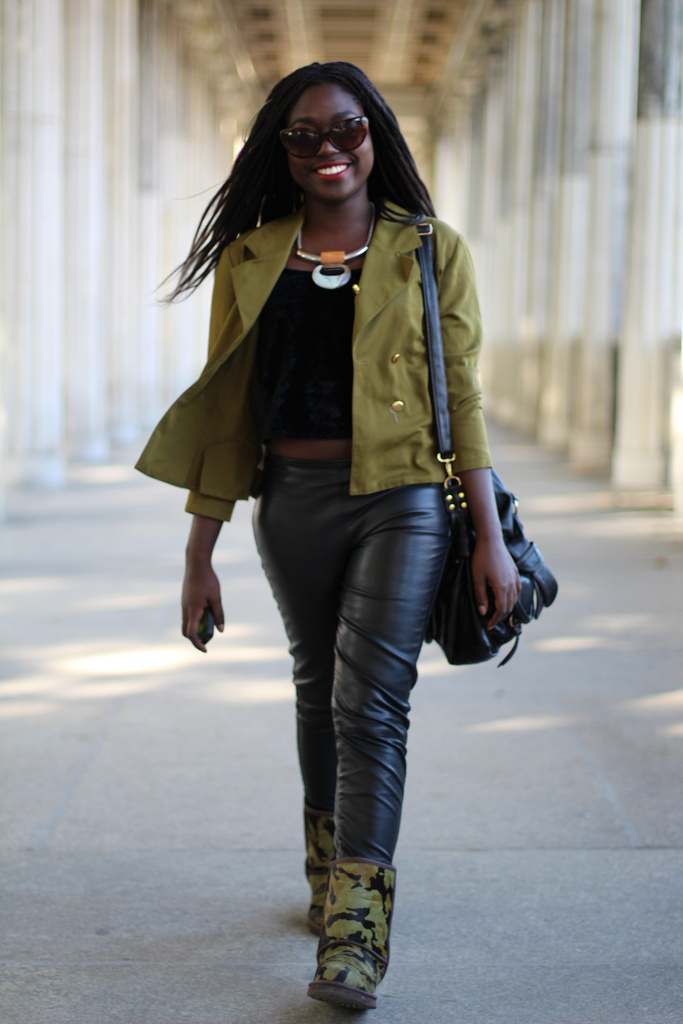 beautiful black girl in army green jacket blue jeans and camouflage color Uggs