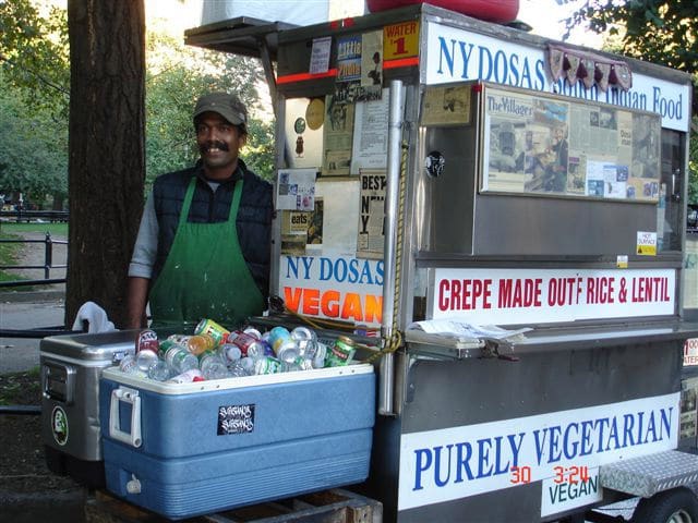 New York City vendor selling Indian crepes; example of street food from a cart.