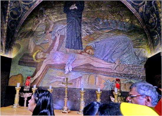 Jesus is nailed to the cross while His mother watches on. Upon entering the steps to Golgotha, first you see the Altar of nails ( Station 11)