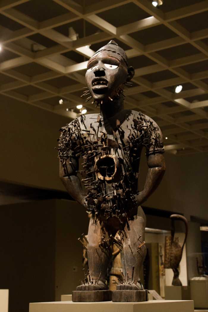 Statue of Power Figure (Nkisi n'kondi) Wood, nails, blades, medicinal material with cowrie shell.