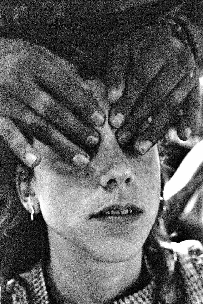 Woman getting pressure points of the face massaged.