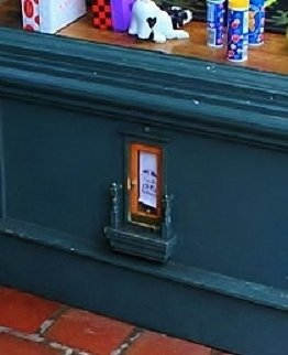 Fairy door in the doorway hutch at a shop called Peaceable Kingom in Ann Arbor. Photo by Dwight Burdette uploaded to Wikimedia Commons.