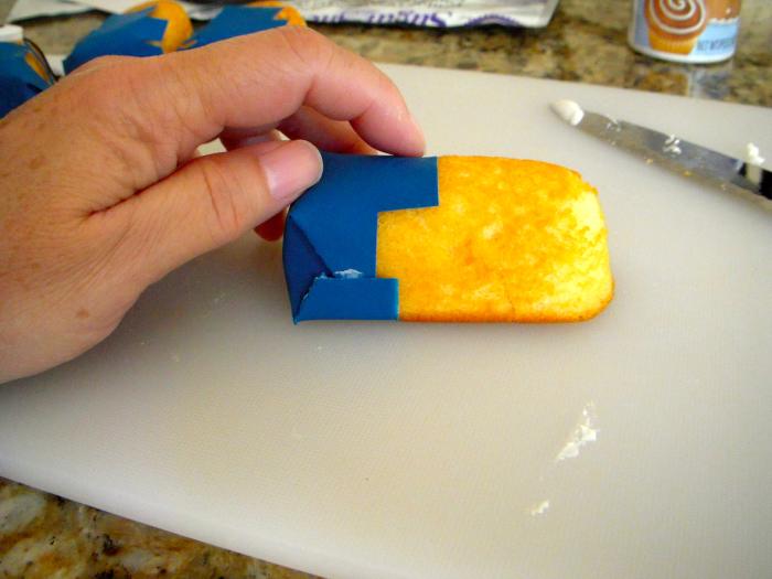 Side view of Twinkie, overall bib on top. Note that the pants sides are folded and pressed in.