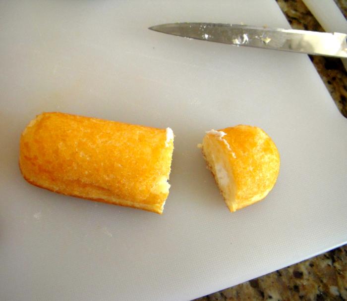 Cut approximately 1" from one end of the Twinkie. The larger piece will be used to make the Minion. Eat the smaller piece.