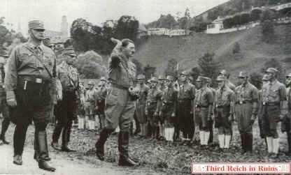 Adolf Hitler reviews a SA (Sturmabteilung) unit in Berchtesgaden in July 1932.