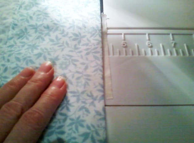 TIP: When machine sewing a large hem with a straight stitch, it helps to use a piece of masking tape to serve as a guide.