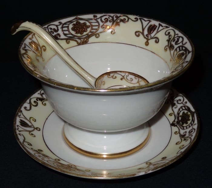It has three pieces the mayonnaise server with an under plate and a very nice ladle. This is a very nice piece, there are no chips, cracks, hairlines or repairs on any piece.