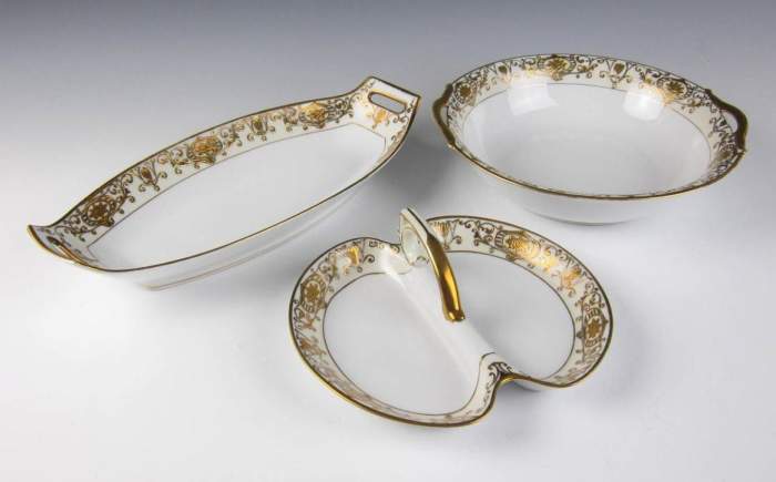The single center handle is just over 8 inches wide. The round bowl is just over 9.75 inches wide from handle to handle. The long dish/tray is just over 13 inches long from handle to handle.