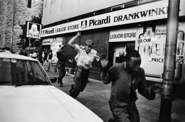 Police attack demonstrators in central Johannesburg on the day that ANC fighter Benjamin Moloise was hanged. October 1985, Johannesburg