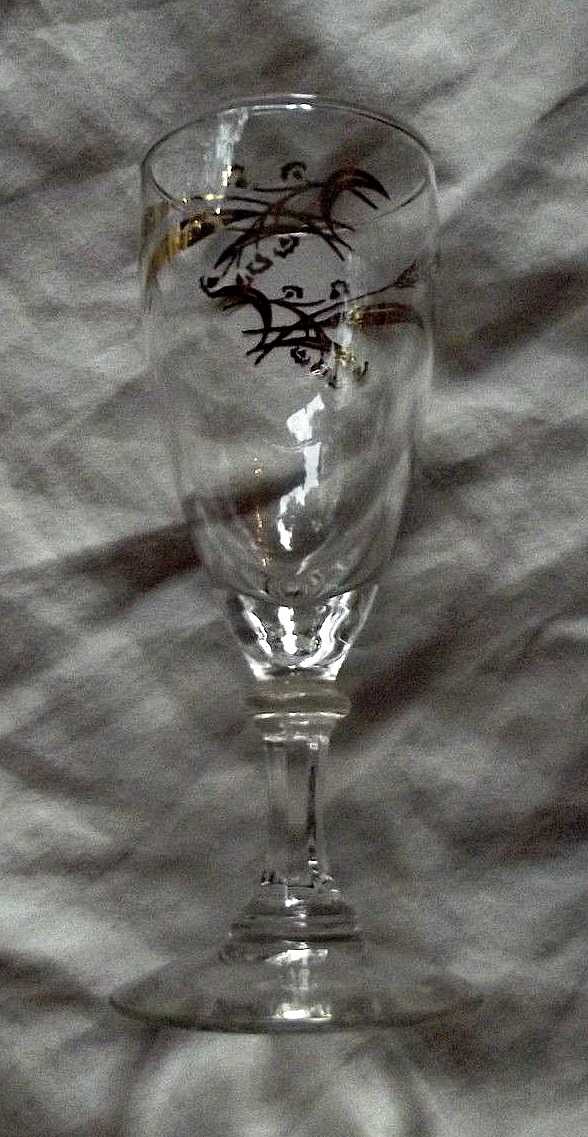 The juice goblets, 5.75" tall in the Prairie Wheat Lifetime gold Golden accent crystal glasses stemware made by Homer Laughlin