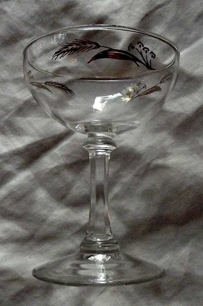 The champagne or cordial, 5" tall in the Prairie Wheat Lifetime gold Golden accent crystal glasses stemware made by Homer Laughlin