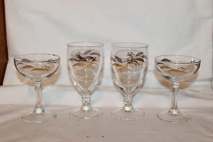 In the photo above are four vintage stemware’s in the Prairie Gold design. The tall waters goblets are 5 3/4" tall and 2 7/8" wide. The champagnes are 4 3/4" x 3 1/2".