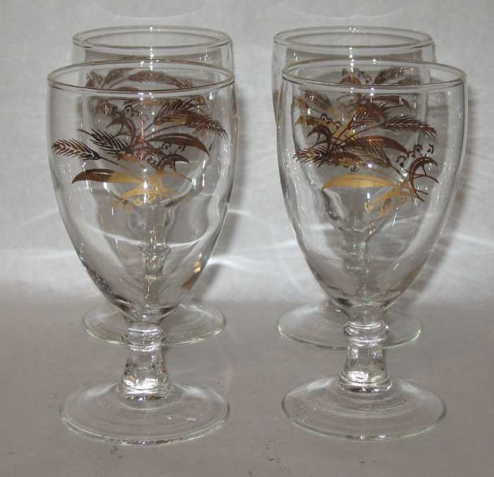 Here are four 8 ounce water goblets they are 5-7/8" tall with real 24k gold accents and designs with golden wheat.