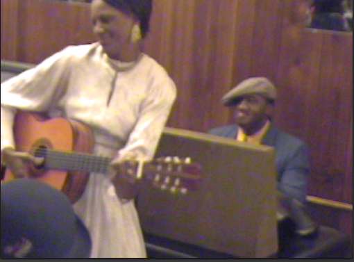 Take Me Back to Beale (Book I) depicts Memphis Minnie performing on Beale Street in the 1920s.