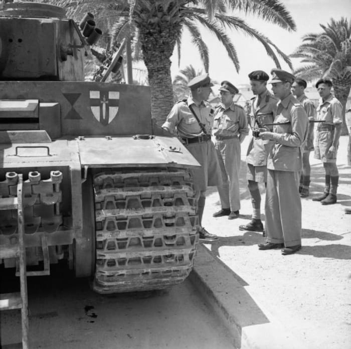 Photo by Sgt Gunn, shows The British Army in Tunisia, 1943. Here, King George VI inspected the captured Tiger Tank 131.