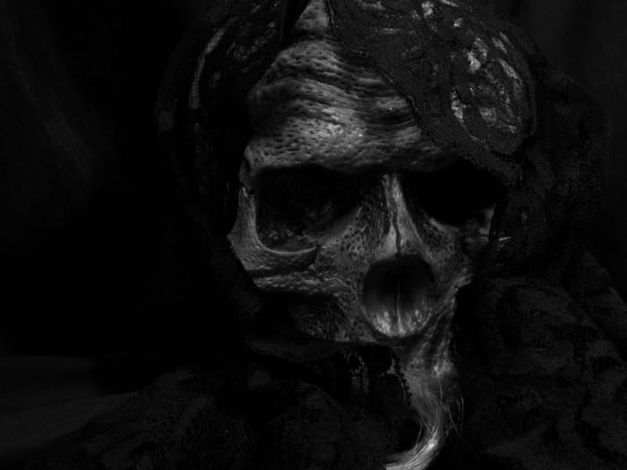 My beautiful lady has this mantilla from the start of our relationship. Far from being scary, this skull actually lights up and pulses with light, much to her amusement.
