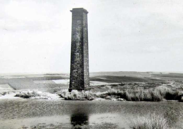 Rosedale Chimney, ventilation duct for underground workings at Rosedale West. This was where Rosedale Village to Hutton-le-Hole road passed, having climbed a steep, winding bank (up to halfway 1:4, and 1:3 towards the crest).