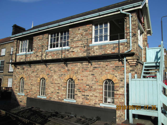 Seen from the front, the signal cabin walkway at window level to keep the glass clean (essential for safety's sake) and stairway painted light blue in the manner of British Railways' North Eastern Region