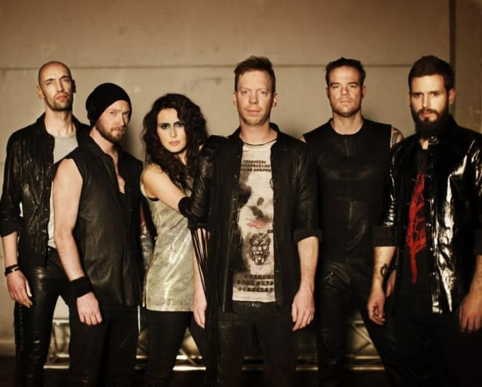 Robert Westerholt (guitars) is at the far left. His brother Martijn is next to him. And Sharon Den Adel is pictured third from the left.