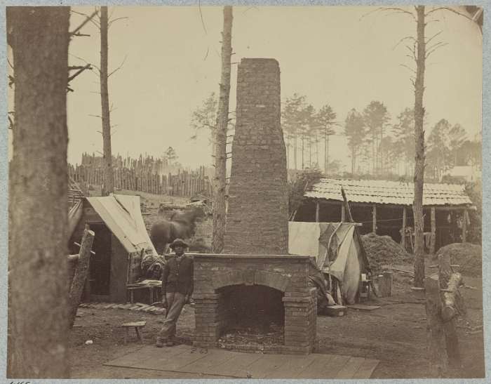 Notice the elaborate fireplace that the soldiers built. The camp is being cleared away and it is left standing alone. This was for a general. Brandy Station