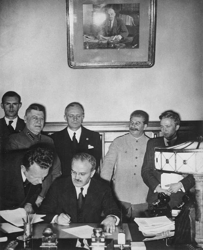Russian Minister of Foreign Affairs Vyacheslav Molotov signs the Molotov–Ribbentrop Pact, a German–Soviet non-aggression pact August 23,1939.