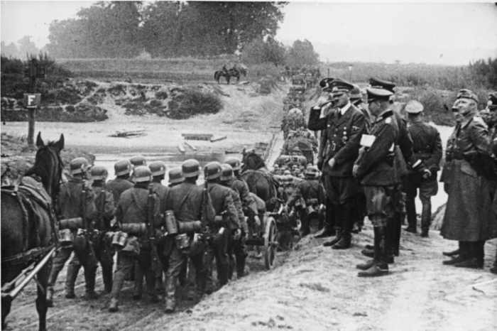 Hitler greets troops on the attack in Poland. He would follow the invasion from his command train near the front-line during the invasion.