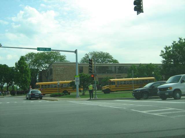 School buses and Hinsdale Police near crosswalk at 55th Street when Hinsdale Central High School dismisses
