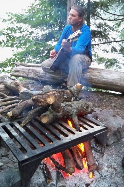 Steve plays us a tune around the campfire. You can collect wood as long as it's away from shore, dead and no longer standing.