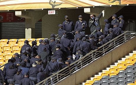 Taking control: Police in South Africa say they have taken permanent control of security at four World Cup stadiums