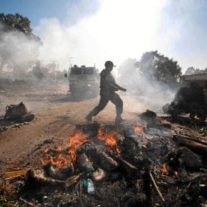You see what we have to do to get the government to listen to us?" said Johannes Melley, about the rubbish and tree trunks used to blockade roads in the township