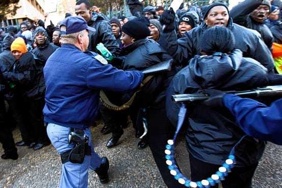 Riot police attempting mob control tactics when they were trying to break-up the Sucurty Guards strike outside Ellis Park