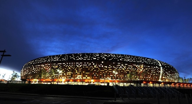 Soccercity At Night. SOCCER CITY STADIUM IN JOHANNESBURG. The showpiece of the World Cup, this striking earth-toned stadium will play host to eight of the tournament’s 64 matches, including the opener and the final. Designed by South Africa-based Bo