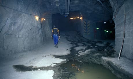 An employee walk through a mine in South Africa. Conflict at Lonmin's platinum mine may put nationalization on the ANC's agenda (by Johan van Tonder)