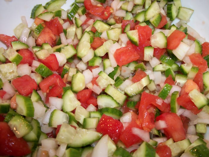 Chopped tomatoes, onions, and cucumbers. Add olive oil, lemon juice, and garlic for Coban Salad. Personal Photo.