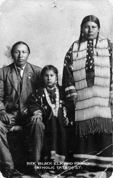 Black Elk, daughter Lucy Black Elk and wife Anna Brings White photographed in their home in Manderson, South Dakota, about 1910